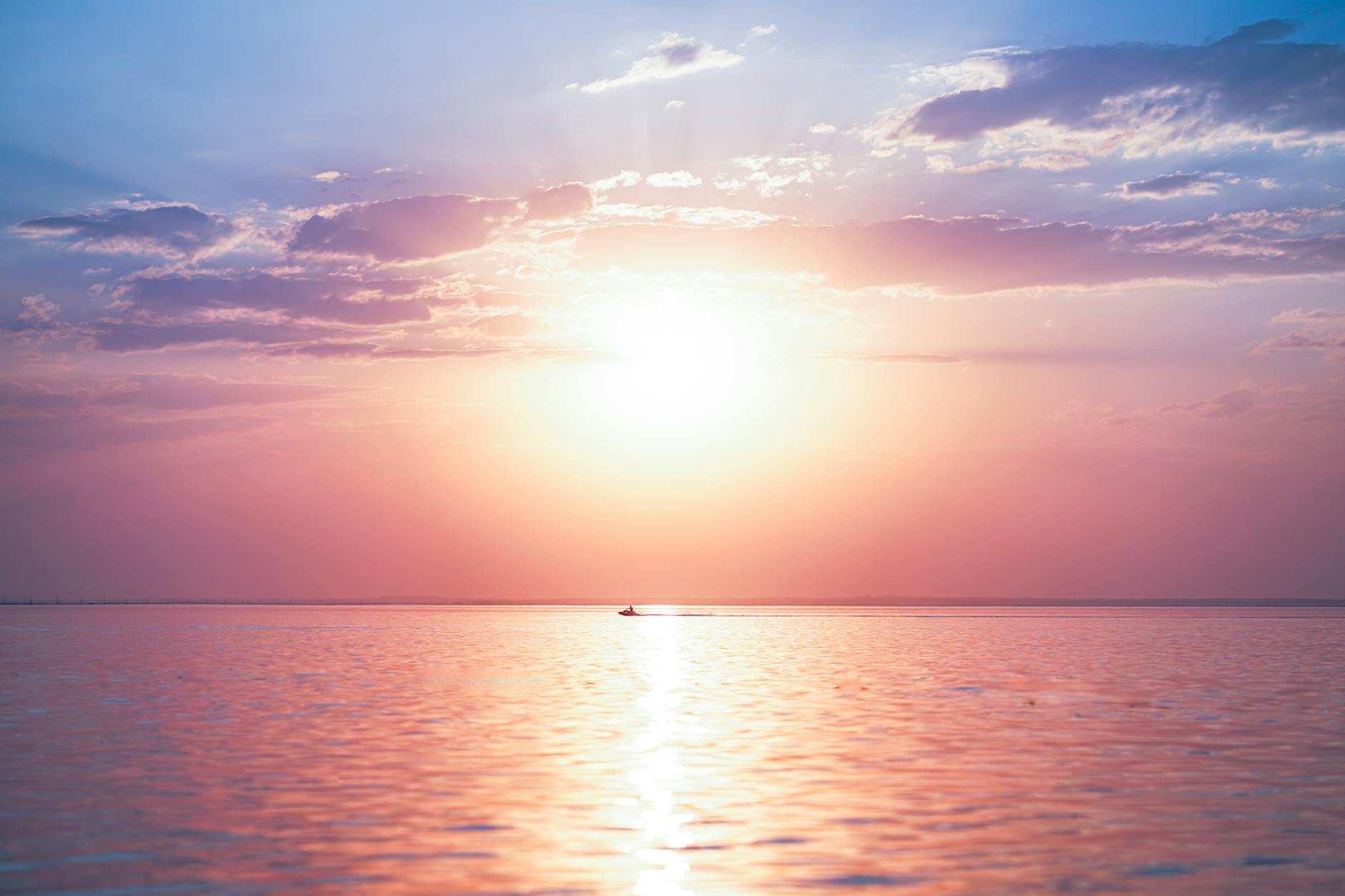 Peaceful sunrise sky with soft blues and golden light